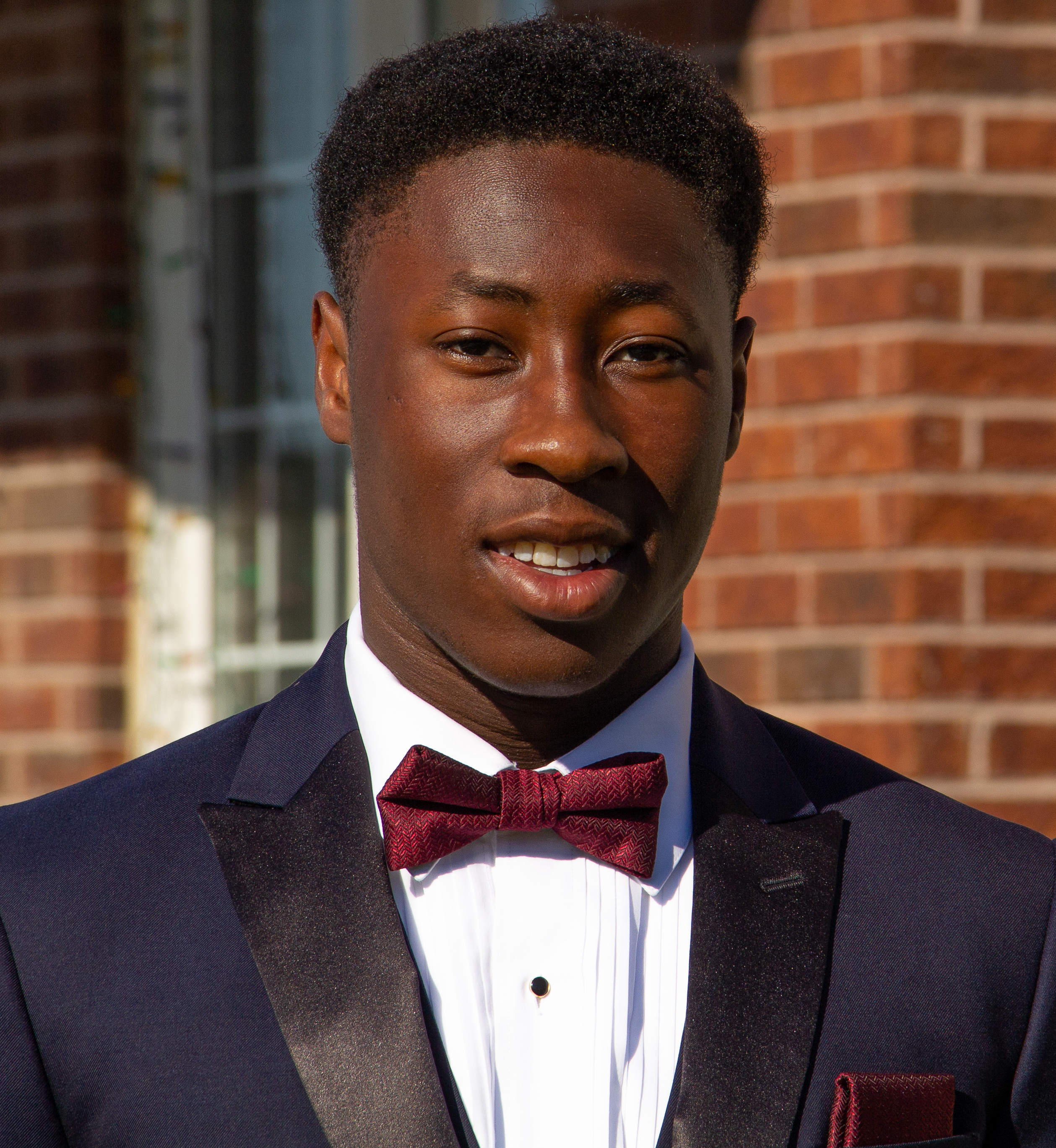 Picture of Jacob Fashanu in a suit with a bow tie